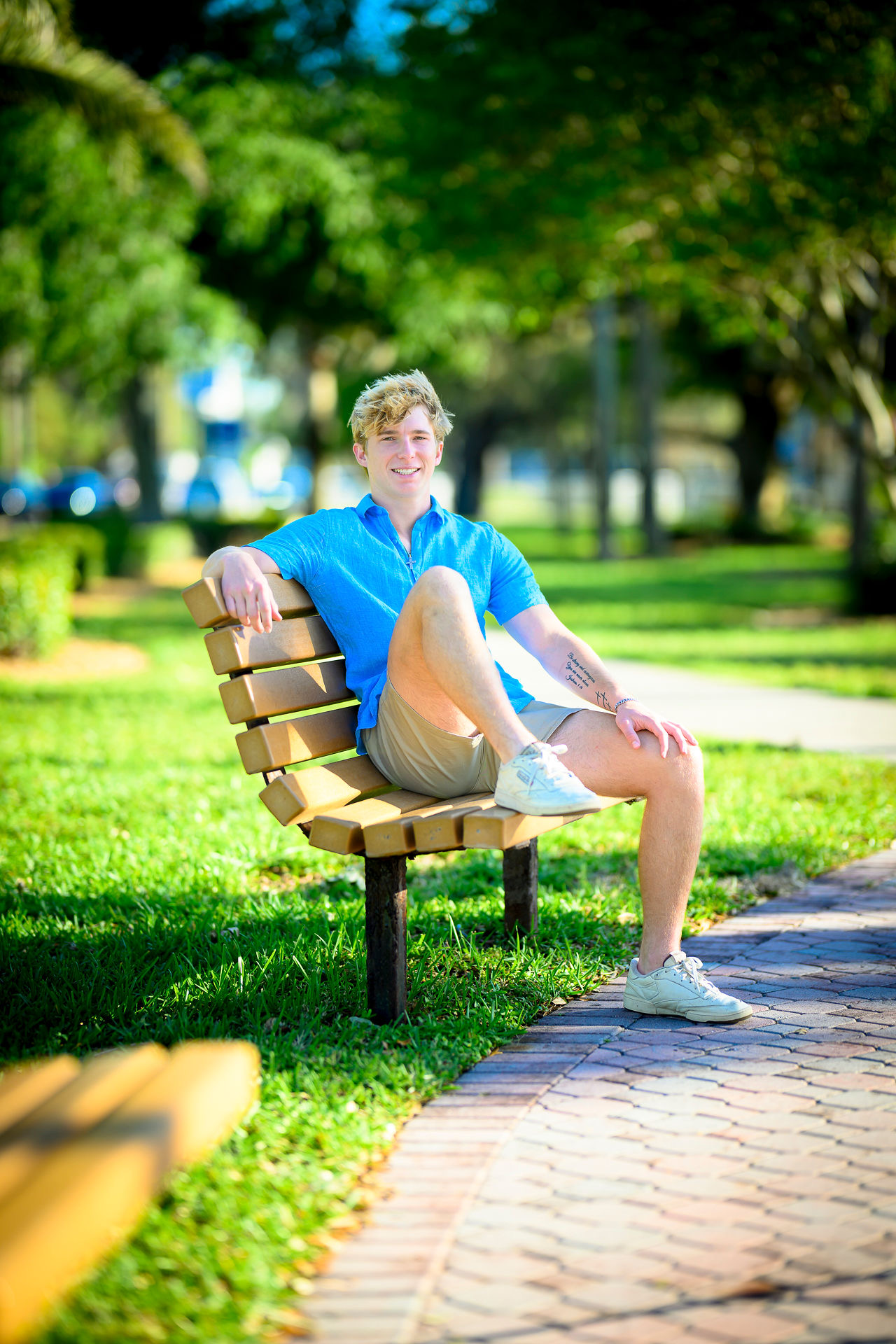 Photo of Carson sitting on a bench